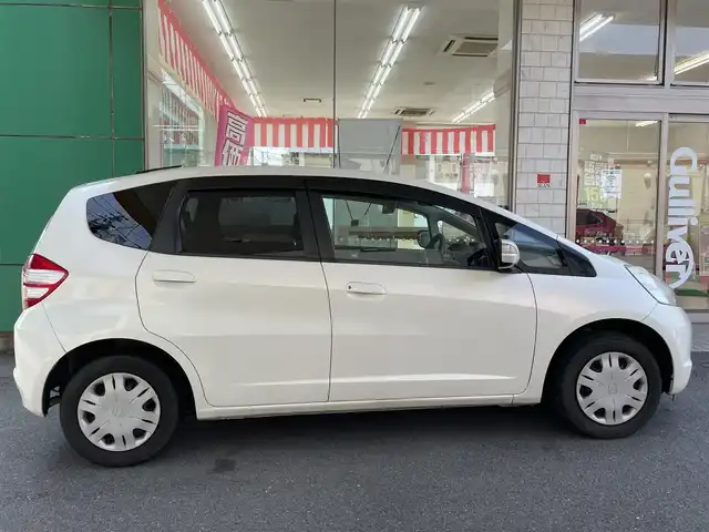 ホンダ フィット L ハイウェイ エディション 愛知県 2009(平21)年 9.1万km プレミアムホワイトパール ワンオーナー/純正HDDインターナビ〈MOP〉/・ワンセグTV/CD/DVD/バックカメラ/ビルトインETC/オートエアコン/オートライト機能付HIDヘッドライト/運転席アームレスト＆シートリフター/前方ドライブレコーダー（ZDR-012）