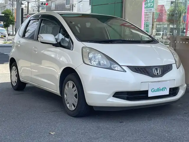 ホンダ フィット L ハイウェイ エディション 愛知県 2009(平21)年 9.1万km プレミアムホワイトパール ワンオーナー/純正HDDインターナビ〈MOP〉/・ワンセグTV/CD/DVD/バックカメラ/ビルトインETC/オートエアコン/オートライト機能付HIDヘッドライト/運転席アームレスト＆シートリフター/前方ドライブレコーダー（ZDR-012）
