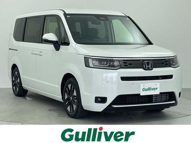 ホンダ ステップワゴン eHEV エアー EX 大阪府 2025(令7)年 0.1千km プラチナホワイトパール 登録済未使用車/純正11.4インチナビ/【AM/FM/CD/DVD/Bluetooth/フルセグTV】/バックカメラ/ホンダセンシング/・衝突軽減ブレーキ/・踏み間違い衝突軽減システム/・歩行者事故低減ステアリング/・路外逸脱抑制機能/・渋滞追従機能付きアダプティブクルーズコントロール/・車線維持支援システム/・トラフィックジャムアシスト/・先行車発進お知らせ機能/・標識認識機能/・オートハイビーム/・ブラインドスポットインフォメーション/・パーキングセンサーシステム/両側電動パワースライドドア/シートヒーター/パワーバックドア/・両側パワースライドドア/・前席シートヒーター/・電動リアゲート/・レーザークルーズコントロール/・オートエアコン/・オートライト