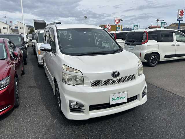 トヨタ ヴォクシー ZS 煌Ⅱ 香川県 2012(平24)年 15万km ホワイトパールクリスタルシャイン アルパイン8型HDDナビ/　CD DVD フルセグTV/バックカメラ/アルパインフリップダウンモニター（TMX-R2200）/両側パワスラ/HIDヘッドライト/オートライト/フォグランプ/革巻きステアリング/ステアリングスイッチ/パドルシフト/MTモード付AT/PWオールオート/プッシュスタート/スマートキー