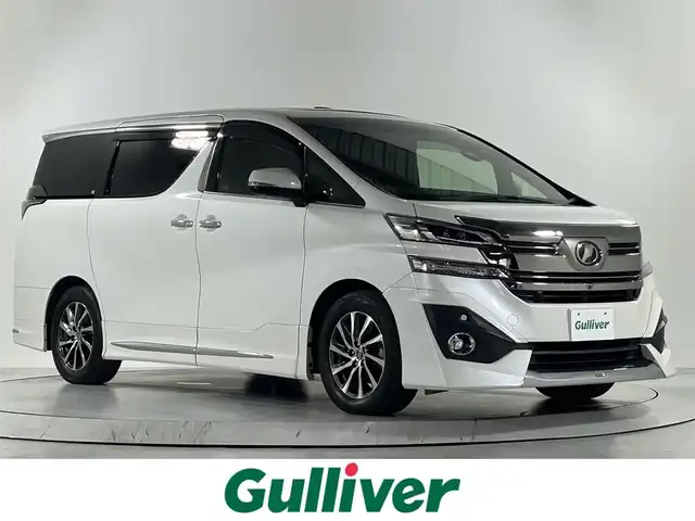 トヨタ ヴェルファイア エグゼクティブ ラウンジ 佐賀県 2017(平29)年 4.8万km ホワイトパールクリスタルシャイン 純正9インチナビ/【フルセグTV.DVD.CD.Bluetooth】/純正12.1インチフリップダウンモニター/サンルーフ/モデリスタエアロ/JBLプレミアムサウンド/全方位カメラ/衝突被害軽減システム/レーダークルーズコントロール/クリアランスソナー/オートライト/オートマチックハイビーム/ブレーキホールド/前方ドライブレコーダー/ビルトインＥＴＣ/両側パワースライドドア/パワーバックドア/レザーシート/運転席・助手席・2列目シートシートヒーター/2列目シートエアシート/運転席・助手席パワーシート/運転席メモリーシート/ステアリングヒーター/ＬＥＤヘッドライト/オートワイパー/後席サンシェード/ダブルエアコン/スマートキー/スペアキー×1