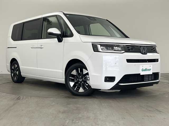 ホンダ ステップワゴン eHEV エアー EX 兵庫県 2025(令7)年 0.1千km プラチナホワイトパール ・登録済未使用車/・11.4インチHonda CONNECTナビ（LXM-247VFLi）/・CD/DVD/BT/SD/・全列USBチャージャー/・フルセグTV/・Honda SENSING/・衝突軽減ブレーキ/・ACC先行車検知音/・先行車発進お知らせ/・路外逸脱抑制機能/・車線維持支援システム/・ブラインドスポットモニター/・標識認識機能/・標識認識機能速度超過お知らせ/・パーキングセンサー/・前後コーナーセンサー/・レーダークルーズコントロール/・バックモニター/・電動パーキングブレーキ/・ブレーキホールド/・減速セレクター/・両側パワースライドドア/・パワーテールゲート/・シートヒーター（運転席＋助手席）/・ウォークスルー/・オットマン/・純正１６インチアルミホイール/・トリプルゾーンコントロール・フルオートエアコンディショナー/・革巻きステアリング/・スマートキー/・スペアキー/・プッシュスタート