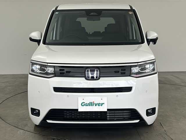 ホンダ ステップワゴン eHEV エアー EX 兵庫県 2025(令7)年 0.1千km プラチナホワイトパール ・登録済未使用車/・11.4インチHonda CONNECTナビ（LXM-247VFLi）/・CD/DVD/BT/SD/・全列USBチャージャー/・フルセグTV/・Honda SENSING/・衝突軽減ブレーキ/・ACC先行車検知音/・先行車発進お知らせ/・路外逸脱抑制機能/・車線維持支援システム/・ブラインドスポットモニター/・標識認識機能/・標識認識機能速度超過お知らせ/・パーキングセンサー/・前後コーナーセンサー/・レーダークルーズコントロール/・バックモニター/・電動パーキングブレーキ/・ブレーキホールド/・減速セレクター/・両側パワースライドドア/・パワーテールゲート/・シートヒーター（運転席＋助手席）/・ウォークスルー/・オットマン/・純正１６インチアルミホイール/・トリプルゾーンコントロール・フルオートエアコンディショナー/・革巻きステアリング/・スマートキー/・スペアキー/・プッシュスタート