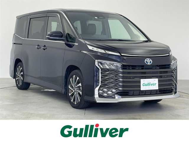 トヨタ ヴォクシー ハイブリッド S－Z 福島県 2023(令5)年 2.2万km スパークリングブラックパールクリスタルシャイン /純正10.5インチディスプレイオーディオPlus//ナビ付/フルセグTV Bluetooth Miracast/CD DVD FM AM HDMI USB//バックカメラ//純正フリップダウンモニター//トヨタセーフティーセンス//アダプティブクルーズコントロール//快適利便パッケージ//ハンズフリーデュアルパワースライドドア//ユニバーサルステップ//パワーバックドア //ステアリングヒーター//オットマン//セカンドシートシートヒーター //フロントシートシートヒーター //電動パーキングブレーキ//ビルトインETC2.0//100Vコンセント