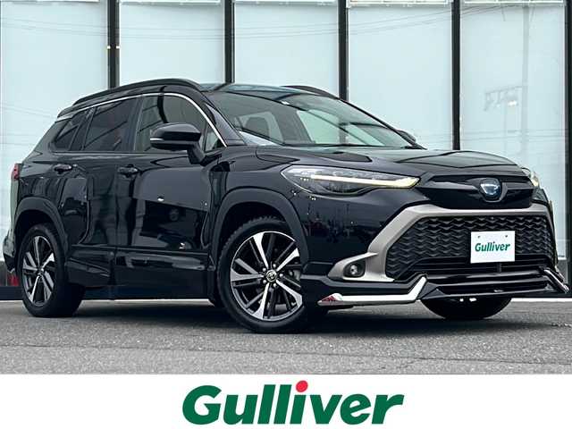 トヨタ カローラ クロス ハイブリッド Z 山形県 2023(令5)年 3.9万km アティチュードブラックマイカ 純正9インチディスプレイオーディオ/（AM/FM/フルセグ/BT/Miracast）/モデリスタエアロ/クルーズコントロール（追従有）/バックカメラ/パノラミックビューモニター/コーナーセンサー/クリアランスソナー/BSM/ステアリングスイッチ/ステアリングヒーター/レザーシート/運転席パワーシート/シートヒーター/オートLEDヘッドライト/オートマチックハイビーム/ワイパーデアイザー/電動パーキング/ビルトインETC/パワーバックドア/ドリンクホルダー