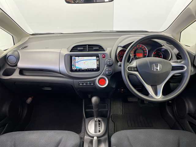 ホンダ フィット G 群馬県 2012(平24)年 1.3万km ピュアブルーメタリック 禁煙車　純正７インチナビ　盗難防止装置　ビルトインＥＴＣ　バックカメラ　ステアリングスイッチ　電動格納ミラー　パワーウィンドウ　オートエアコン　オートライト　スマートキー　ＨＩＤライト　ＥＣＯＮモード