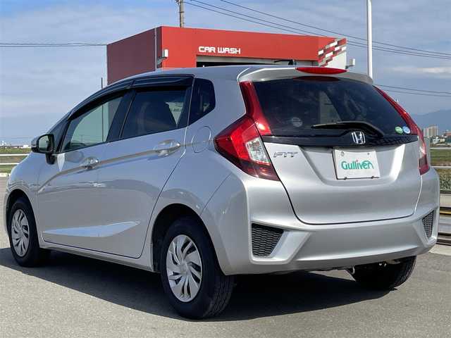ホンダ フィット 13G Fパッケージ 佐賀県 2016(平28)年 11.3万km アラバスターシルバーメタリック 社外7型SDナビ(ワンセグTV/CD/DVD/BT)/バックモニター/横滑り防止装置/アイドリングストップ/純正HIDヘッドライト/純正フロアマット/ETC/スマートキー/プッシュスタート/盗難防止装置
