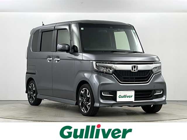 ホンダ Ｎ ＢＯＸ カスタム G L ターボ ホンダセンシング 長野県 2019(平31)年 4.2万km シャイニンググレーM 純正ナビ【Gathers VXU-195NBi】/（Bluetooth・フルセグ・CD・DVD・USB）/Honda SENSING/衝突軽減ブレーキ/誤発進抑制機能/後方誤発進抑制機能/歩行者事故低減ステアリング/路外逸脱抑制機能/アダプティブ・クルーズ・コントロール/車線維持支援システム/先行車発進お知らせ機能/標識認識機能/両側パワースライドドア/後方コーナーセンサー/前後ドライブレコーダー/ステアリングスイッチ/パドルシフト/ベンチシート/ハーフレザーシート/アレルクリーンシート/チップアップシート/LEDヘッドライト/フォグランプ/ETC/純正フロアマット/ドアバイザー/プッシュスタート