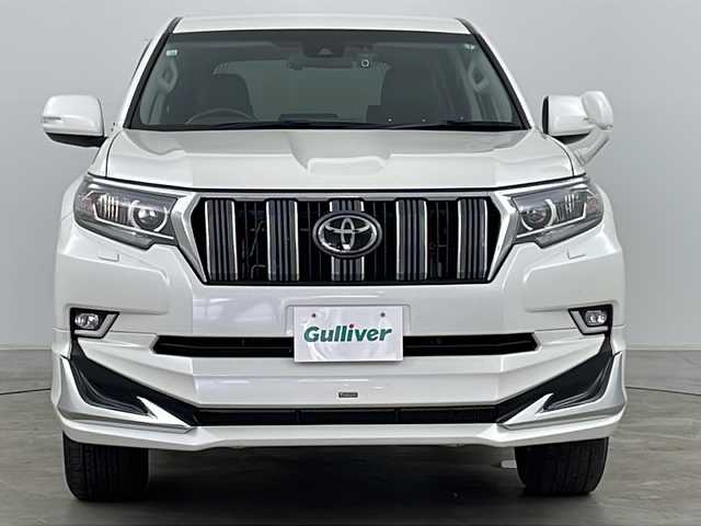 トヨタ ランドクルーザー プラド TX 道央・札幌 2020(令2)年 3.7万km ホワイトパールクリスタルシャイン ・ワンオーナー/・寒冷地仕様/・純正ナビ(CD＆DVD＆SD＆BT＆フルセグ)/・レーン・ディパーチャー・アラート/・プリクラッシュセーフティ/・ロードサインアシスト/・先行車発進告知/・レーダークルーズコントロール/・ステアリングスイッチ/・バックカメラ/・バックフォグ/・社外ドライブレコーダー/・全席シートカバー/・純正フロアマット/・ドアミラーヒーター/・オートマチックハイビーム/・純正エンジンスターター/・純正17インチアルミホイール/・社外ヒッチメンバー/・社外ルーフキャリア/・フロントモデリスタエアロ/・LEDヘッドライト/・LEDフォグランプ/・社外ヒッチメンバー/・社外キャリア
