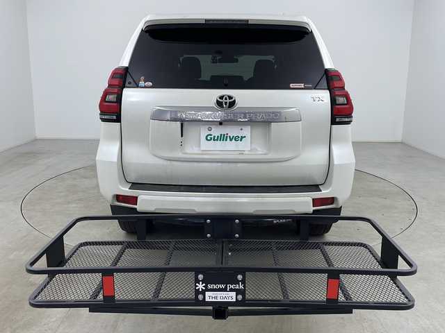 トヨタ ランドクルーザー プラド TX 道央・札幌 2020(令2)年 3.7万km ホワイトパールクリスタルシャイン ・ワンオーナー/・寒冷地仕様/・純正ナビ(CD＆DVD＆SD＆BT＆フルセグ)/・レーン・ディパーチャー・アラート/・プリクラッシュセーフティ/・ロードサインアシスト/・先行車発進告知/・レーダークルーズコントロール/・ステアリングスイッチ/・バックカメラ/・バックフォグ/・社外ドライブレコーダー/・全席シートカバー/・純正フロアマット/・ドアミラーヒーター/・オートマチックハイビーム/・純正エンジンスターター/・純正17インチアルミホイール/・社外ヒッチメンバー/・社外ルーフキャリア/・フロントモデリスタエアロ/・LEDヘッドライト/・LEDフォグランプ/・社外ヒッチメンバー/・社外キャリア