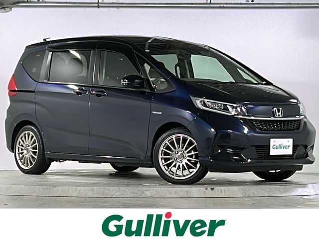 ホンダ フリード ハイブリット G ホンダセンシング 広島県 2021(令3)年 6.4万km ミッドナイトブルービームM 禁煙車/ホンダセンシング/・衝突軽減ブレーキ/・追従式クルーズコントロール/・LKAS/コーナーセンサー/純正9型ナビ（VXM-217VFNi)/・フルセグ/CD/DVD/Bluetooth/SD/REC//HDMI/USB/バックカメラ/両側パワースライドドア/オートリトラミラー/LEDヘッドライト＋アクティブコーナリングライト/Cパッケージ/・ロールサンシェード/・シートヒーター/・コンフォートビューパッケージ/・プラズマクラスターエアコン/前後ドライブレコーダー（ユピテル）/ETC/純正ドアバイザー/社外17インチアルミホイール