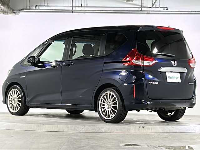 ホンダ フリード ハイブリット G ホンダセンシング 広島県 2021(令3)年 6.4万km ミッドナイトブルービームM 禁煙車/ホンダセンシング/・衝突軽減ブレーキ/・追従式クルーズコントロール/・LKAS/コーナーセンサー/純正9型ナビ（VXM-217VFNi)/・フルセグ/CD/DVD/Bluetooth/SD/REC//HDMI/USB/バックカメラ/両側パワースライドドア/オートリトラミラー/LEDヘッドライト＋アクティブコーナリングライト/Cパッケージ/・ロールサンシェード/・シートヒーター/・コンフォートビューパッケージ/・プラズマクラスターエアコン/前後ドライブレコーダー（ユピテル）/ETC/純正ドアバイザー/社外17インチアルミホイール