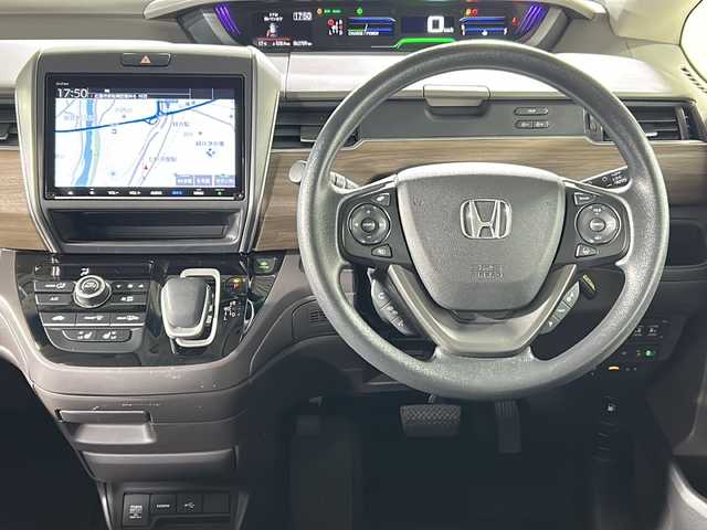 ホンダ フリード ハイブリット G ホンダセンシング 広島県 2021(令3)年 6.4万km ミッドナイトブルービームM 禁煙車/ホンダセンシング/・衝突軽減ブレーキ/・追従式クルーズコントロール/・LKAS/コーナーセンサー/純正9型ナビ（VXM-217VFNi)/・フルセグ/CD/DVD/Bluetooth/SD/REC//HDMI/USB/バックカメラ/両側パワースライドドア/オートリトラミラー/LEDヘッドライト＋アクティブコーナリングライト/Cパッケージ/・ロールサンシェード/・シートヒーター/・コンフォートビューパッケージ/・プラズマクラスターエアコン/前後ドライブレコーダー（ユピテル）/ETC/純正ドアバイザー/社外17インチアルミホイール