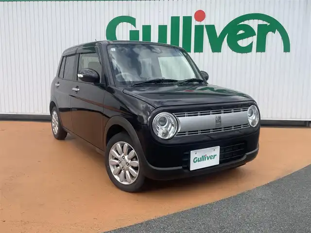 スズキ ラパン X 三重県 2021(令3)年 6万km アーバンブラウンパールメタリック ストラーダメモリナビ/　＊フルセグテレビ/Bluetooth/バックカメラ/セーフティサポート/HIDヘッドランプ/オートライト/ボディ同色電動オート格納ドアミラー/155/65R14タイヤ/　＊14インチアルミホイール/オートエアコン/ナノイー/エコクール/革巻ステアリングホイール/ステアリングスイッチ/シートヒーター（運転席/助手席）/照明付バニティミラー（運転席/助手席）/キーレス/プッシュスタート