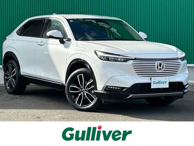 ホンダ ヴェゼル ハイブリッド e:HEV Z 宮城県 2024(令6)年 3.8万km プラチナホワイトパール Honda CONNECTディスプレー（9インチ）/・Bluetooth/・フルセグTV/・バックカメラ/＋ETC2.0車載器/＋ワイヤレス充電器/後退出庫サポート/＝＝＝/ワンオーナー/ホンダセンシング/・衝突軽減ブレーキ/・誤発進抑制機能/・後方誤発進抑制機能/・近距離衝突軽減ブレーキ/・歩行者事故低減ステアリング/・路外逸脱抑制機能/・渋滞追従機能付アダプティブクルーズコントロール/・車線維持支援システム/・先行車発進お知らせ機能/・標識認識機能/・オートハイビーム/・パーキングセンサーシステム/ブラインドスポットインフォメーション/ハンズフリーパワーバックドア/ハーフレザーシート/シートヒーター/ステアリングヒーター/革巻きステアリング/ステアリングスイッチ/パドルシフト/LEDヘッドランプ/LEDアクティブコーナリングライト/シーケンシャルターンランプ/オートライト/電動パーキングブレーキ/ブレーキホールド/スマートキー＆プッシュスタート/純正18インチAW