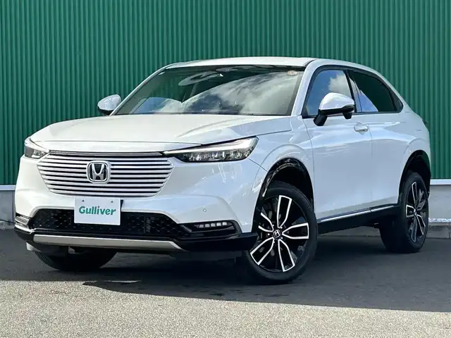 ホンダ ヴェゼル ハイブリッド e:HEV Z 宮城県 2024(令6)年 3.8万km プラチナホワイトパール Honda CONNECTディスプレー（9インチ）/・Bluetooth/・フルセグTV/・バックカメラ/＋ETC2.0車載器/＋ワイヤレス充電器/後退出庫サポート/＝＝＝/ワンオーナー/ホンダセンシング/・衝突軽減ブレーキ/・誤発進抑制機能/・後方誤発進抑制機能/・近距離衝突軽減ブレーキ/・歩行者事故低減ステアリング/・路外逸脱抑制機能/・渋滞追従機能付アダプティブクルーズコントロール/・車線維持支援システム/・先行車発進お知らせ機能/・標識認識機能/・オートハイビーム/・パーキングセンサーシステム/ブラインドスポットインフォメーション/ハンズフリーパワーバックドア/ハーフレザーシート/シートヒーター/ステアリングヒーター/革巻きステアリング/ステアリングスイッチ/パドルシフト/LEDヘッドランプ/LEDアクティブコーナリングライト/シーケンシャルターンランプ/オートライト/電動パーキングブレーキ/ブレーキホールド/スマートキー＆プッシュスタート/純正18インチAW