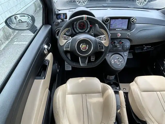 アバルト ６９５ エディツィオーネ マセラティ 新潟県 2013(平25)年 6万km パープル JBL/社外ナビ/(AM/FM/CD/DVD/BT/フルセグ)/バックカメラ/ETC/パドルシフト/レーダー探知機(GWR83sda)/レザーシート/革巻きステアリング/ステアリングスイッチ/HIDヘッドライト/フォグランプ/リモコンキー/オープン可能/幌をブラックに塗装/カラーコード：１４２/カラー名：ポンテヴェッキオボルドー