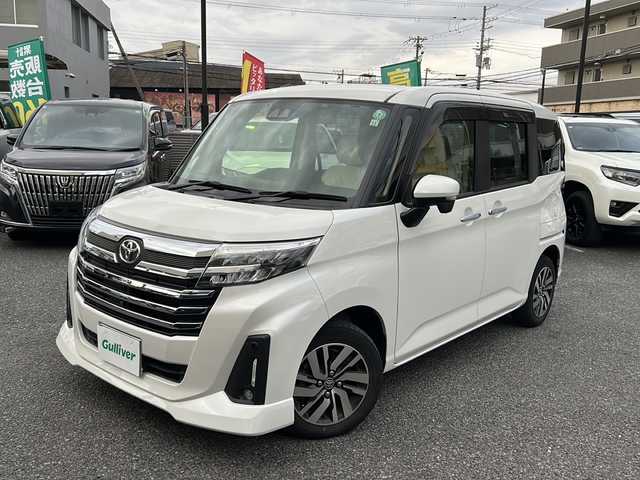 トヨタ ルーミー カスタムG 大阪府 2021(令3)年 2.5万km パールホワイトⅢ ワンオーナー/両側パワースライドドア/レーダークルコン/マルチテレインモニター/コーナーセンサー/前席シートヒーター/純正9インチSDナビ/　CD.DVD.BT.フルセグTV/スマートキー×2/プッシュスタート/TZドライブレコーダー/ビルトインETC/純正フロアマット/保証書.取説