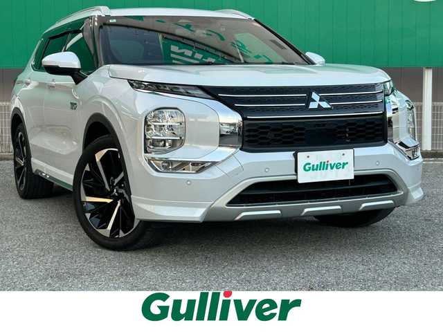 三菱 アウトランダー ＰＨＥＶ P 千葉県 2022(令4)年 3万km ホワイトダイヤモンド ディーラーオプションナビ/(フルセグTV/Bluetooth/AM/FM)/BOSEスピーカー/ワンオーナー/Apple Carplay/全方位カメラ/前後ドライブレコーダー/前席パワーシート/全席シートヒーター/電動リアゲート/ブラインドスポットモニター/レーダークルーズコントロール/ETC2.0/4WD/ルーフレール/ステアリングヒーター/パドルシフト/ステアリングスイッチ/レザーシート/純正アルミホイール/純正フロアマット/純正LEDヘッドライト/前後コーナーセンサー/レーンキープアシスト/衝突軽減ブレーキ/横滑り防止装置/USB入力端子/オートライト/スマートキー/スペアキー/プッシュエンジンスタート