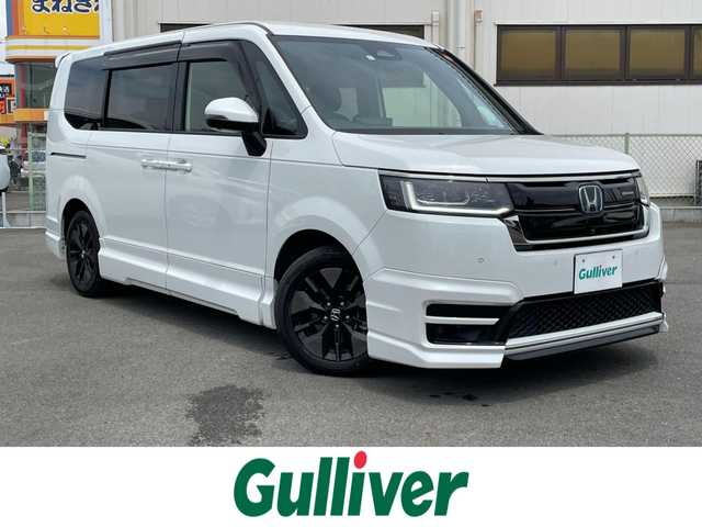 ホンダ ステップワゴン スパーダ eHEV 群馬県 2023(令5)年 5.8万km プラチナホワイトパール 無限フルエアロ/純正１１．４インチナビ/フルセグTV・CD・DVD・FM・AM・Bluetooth/フリップダウンモニター/ホンダセンシング/電動リアゲート/両側電動/追従クルコン/パドルシフト/電動ブレーキ/前席シートヒーター/全方位カメラ/BSM/レーンキープアシスト/ＬＥＤライト/オートライト/純正フロアマット/ドアバイザー/横滑り防止