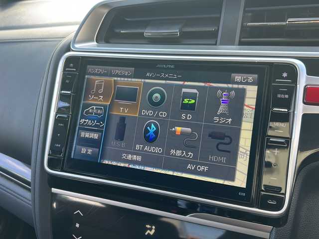 ホンダ フィット ハイブリット Sパッケージ 石川県 2015(平27)年 6.1万km ホワイトオーキッドパール 社外８インチＳＤナビ/フルセグＴＶ/バックカメラ/Ｂｌｕｅｔｏｏｔｈ/ＥＴＣ/プッシュスタート/ＬＥＤライト/オートライト/クルーズコントロール/スペアキー有/純正サイドエアロ/純正アルミホイール/カーテンエアバッグ/リアウィング