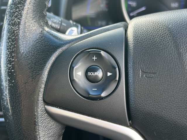 ホンダ フィット ハイブリット Sパッケージ 石川県 2015(平27)年 6.1万km ホワイトオーキッドパール 社外８インチＳＤナビ/フルセグＴＶ/バックカメラ/Ｂｌｕｅｔｏｏｔｈ/ＥＴＣ/プッシュスタート/ＬＥＤライト/オートライト/クルーズコントロール/スペアキー有/純正サイドエアロ/純正アルミホイール/カーテンエアバッグ/リアウィング