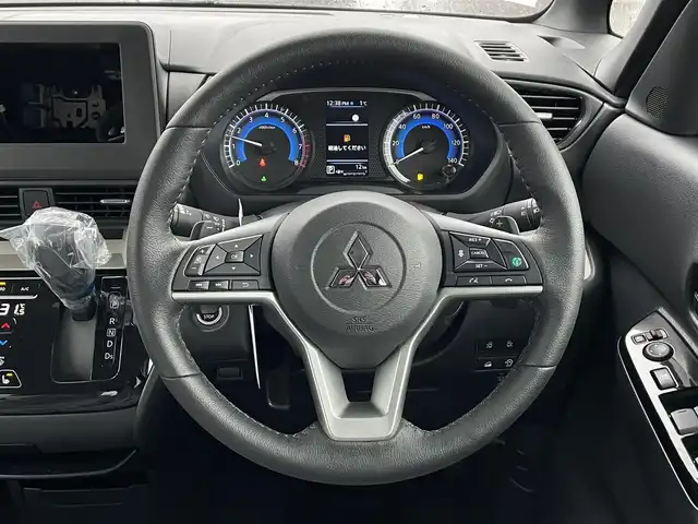 三菱 デリカミニ T プレミアム 道南・函館 2025(令7)年 0.1千km Ｄグリーン /全周囲カメラ//デジタルインナーミラー//ハンドルウォーマー//シートヒーター//両側パワースライドドア//ルーフレール//衝突被害軽減ブレーキ//レーダクルーズコントロール//オートハイビーム//コーナーセンサー