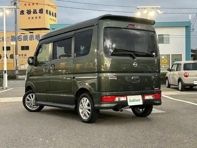 日産 ＮＶ１００クリッパー リオ E 愛媛県 2021(令3)年 3万km ＤグリーンＭ 登録時走行距離29902km/純正ナビ（MJ321D-W）/CD/DVD/TV/BT/バックカメラ/ETC/前後ドラレコ（ナビ連動）/衝突軽減ブレーキ/横滑り防止装置/リヤコーナーセンサー/オートライト/LEDヘッドライト/ハロゲンフォグランプ/助手席パワースライドドア/オートエアコン/リヤクーラー/スマートキー/運転席シートヒーター/純正フロアマット/純正アルミホイール