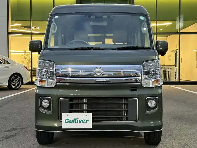 日産 ＮＶ１００クリッパー リオ E 愛媛県 2021(令3)年 3万km ＤグリーンＭ 登録時走行距離29902km/純正ナビ（MJ321D-W）/CD/DVD/TV/BT/バックカメラ/ETC/前後ドラレコ（ナビ連動）/衝突軽減ブレーキ/横滑り防止装置/リヤコーナーセンサー/オートライト/LEDヘッドライト/ハロゲンフォグランプ/助手席パワースライドドア/オートエアコン/リヤクーラー/スマートキー/運転席シートヒーター/純正フロアマット/純正アルミホイール