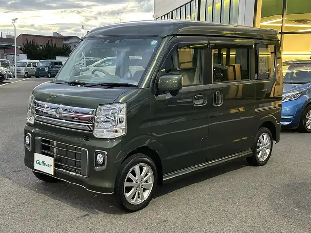 日産 ＮＶ１００クリッパー リオ E 愛媛県 2021(令3)年 3万km ＤグリーンＭ 登録時走行距離29902km/純正ナビ（MJ321D-W）/CD/DVD/TV/BT/バックカメラ/ETC/前後ドラレコ（ナビ連動）/衝突軽減ブレーキ/横滑り防止装置/リヤコーナーセンサー/オートライト/LEDヘッドライト/ハロゲンフォグランプ/助手席パワースライドドア/オートエアコン/リヤクーラー/スマートキー/運転席シートヒーター/純正フロアマット/純正アルミホイール