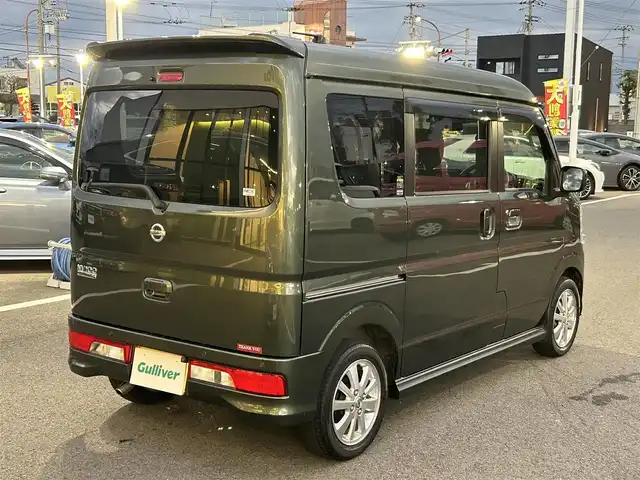 日産 ＮＶ１００クリッパー リオ E 愛媛県 2021(令3)年 3万km ＤグリーンＭ 登録時走行距離29902km/純正ナビ（MJ321D-W）/CD/DVD/TV/BT/バックカメラ/ETC/前後ドラレコ（ナビ連動）/衝突軽減ブレーキ/横滑り防止装置/リヤコーナーセンサー/オートライト/LEDヘッドライト/ハロゲンフォグランプ/助手席パワースライドドア/オートエアコン/リヤクーラー/スマートキー/運転席シートヒーター/純正フロアマット/純正アルミホイール