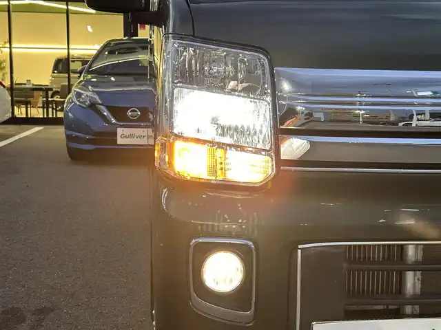 日産 ＮＶ１００クリッパー リオ E 愛媛県 2021(令3)年 3万km ＤグリーンＭ 登録時走行距離29902km/純正ナビ（MJ321D-W）/CD/DVD/TV/BT/バックカメラ/ETC/前後ドラレコ（ナビ連動）/衝突軽減ブレーキ/横滑り防止装置/リヤコーナーセンサー/オートライト/LEDヘッドライト/ハロゲンフォグランプ/助手席パワースライドドア/オートエアコン/リヤクーラー/スマートキー/運転席シートヒーター/純正フロアマット/純正アルミホイール