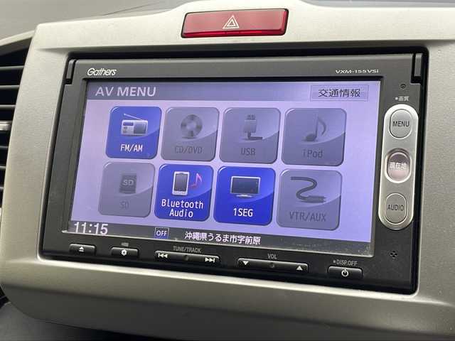 ホンダ フリード ハイブリット ジャストセレクション 沖縄県 2015(平27)年 6.6万km プレミアムディープロッソパール 純正ナビ(VXM-155VSi)/（TV/ＡＭ／ＦＭ／DVD／Bluetooth）/バックカメラ　/ビルトインＥＴＣ/クルーズコントロール　　/ステアリングスイッチ/両側パワースライドドア　/横滑り防止装置　/盗難防止装置　/純正フロアマット　/オートエアコン/オートライト/パワーステアリング/パワーウィンドウ