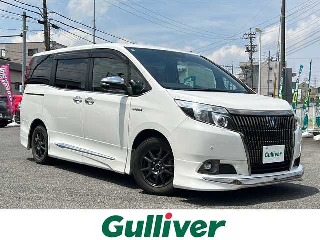 トヨタ エスクァイア ハイブリッド Gi ブラックテーラード 愛知県 2017(平29)年 8.8万km ホワイトパールクリスタルシャイン /禁煙車//アルパイン１１インチナビ//フルセグTV.BT.CD.DVD//アルパインフリップダウンモニター//モデリスタエアロ//バックカメラ/ETC//ドライブレコーダー//黒合皮革シート//前席シートヒーター//ステアリングスイッチ//セーフティセンス//PCS/LDA/AHB//コーナーセンサー//LEDオートライト//電動格納ミラーウインカー//純正フロアマット//新車保証書/取扱説明書//スペアキー