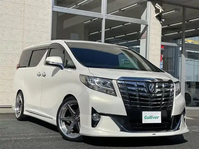 トヨタ アルファード エグゼクティブ ラウンジ 埼玉県 2015(平27)年 13万km ラグジュアリーホワイトパールクリスタルシャインガラスフレーク /4WD//Wサンルーフ//JBL純正10型メモリナビ//フルセグTV//全方位カメラ//フリップダウンモニター//CD/DVD/Bluetooth//黒レザーシート//前2席パワーシート//前2席&2列目シートヒーター//2列目エアシート//助手席&2列目オットマン//両側パワースライドドア//パワーバックドア//アダプティブクルーズコントロール//ビルトインETC//スマートキー//LEDヘッドライト//ステアリングヒーター//PCS衝突軽減ブレーキ//W.サイドエアバッグ//カーテン.ニーエアバッグ//ABS//横滑り防止装置//クリアランスソナー//オートライト/オートハイビーム//スモークフィルム//ドアバイザー//モデリスタエアロ//TEIN車高調//社外21インチAW//新車時保証書//取扱説明書//ナビ取説