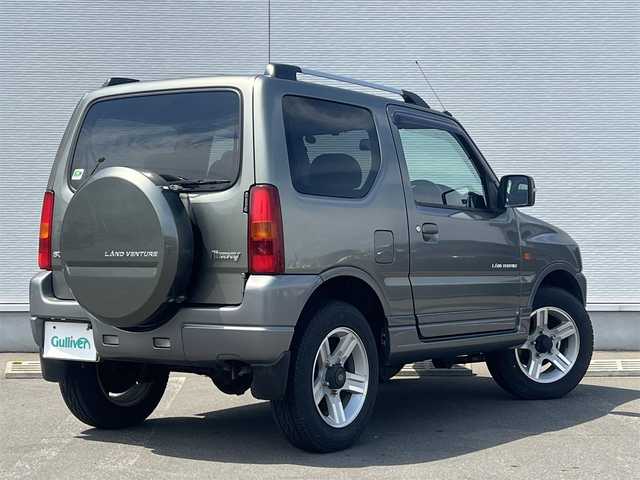 スズキ ジムニー ランドベンチャー 秋田県 2008(平20)年 10.4万km オリーブグレーメタリック 社外ナビ/フルセグ/ターボ/バックカメラ/リモコンキー/純正アルミ/運転席席シートヒーター/MTモード付AT/純正フロアマット/純正ドアバイザー/ルーフレール/背面タイヤ/パワーステアリング/パワーウィンドウ/レベライザー/電動格納ウィンカーミラー/保証書/取扱説明書/記録簿