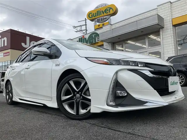 トヨタ プリウス ＰＨＶ S 滋賀県 2017(平29)年 9.4万km ホワイトパールクリスタルシャイン 車検8年6月まで/トヨタセーフティセンス/クルーズコントロール/モデリスタエアロ（フロント、サイド、リア）/純正9インチナビ/Bluetooth、CD、DVD、フルセグテレビ/バックカメラ/ビルトインETC/前席シートヒーター/ステアリングヒーター/純正LEDヘッドライト・LEDフォグランプ/充電ケーブル有り/純正ゴムマット/取扱説明書/保証書