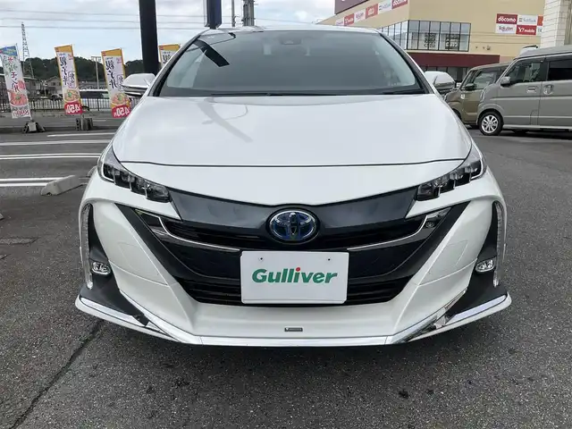 トヨタ プリウス ＰＨＶ S 滋賀県 2017(平29)年 9.4万km ホワイトパールクリスタルシャイン 車検8年6月まで/トヨタセーフティセンス/クルーズコントロール/モデリスタエアロ（フロント、サイド、リア）/純正9インチナビ/Bluetooth、CD、DVD、フルセグテレビ/バックカメラ/ビルトインETC/前席シートヒーター/ステアリングヒーター/純正LEDヘッドライト・LEDフォグランプ/充電ケーブル有り/純正ゴムマット/取扱説明書/保証書