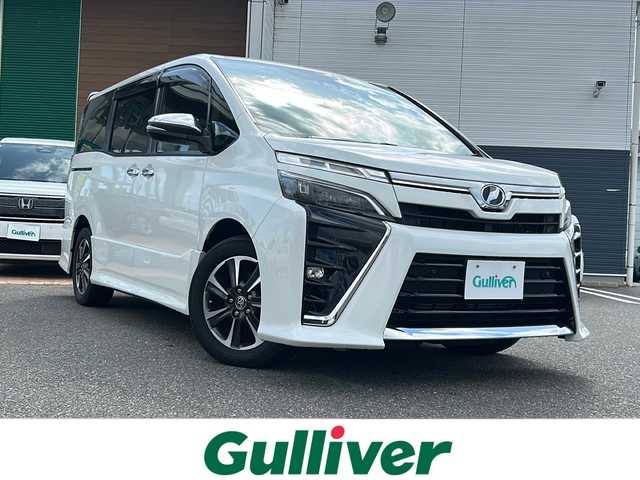トヨタ ヴォクシー ZS 煌Ⅱ 佐賀県 2019(令1)年 7.6万km ホワイトパールクリスタルシャイン 純正ナビ(NSZT-Y68T)/Bluetooth/CD/DVD/フルセグTV/バックアップ/衝突軽減システム/レーンキープアシスト/クルーズコントロール/クリアランスソナー/前後ドライブレコーダー/両側パワースライドドア/LEDオートライト／オートマチックハイビーム/ダブルエアコン/フリップダウンモニター/チップアップシート/ETC/保証書/取扱説明書/点検記録簿(R1/2/3/4/6)