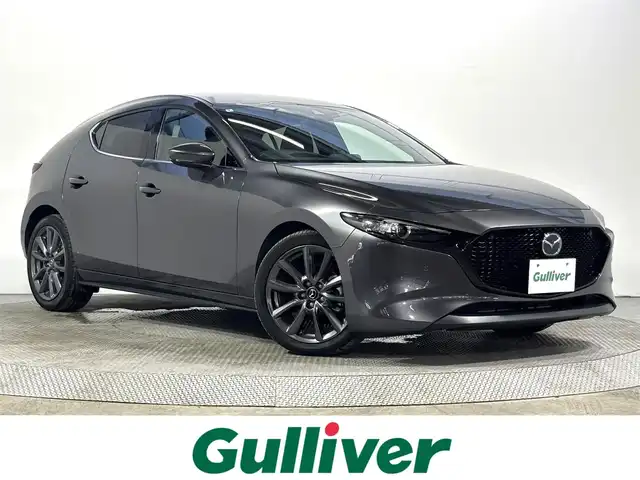 マツダ マツダ３ファストバック 15S ツーリング 大阪府 2020(令2)年 1.2万km マシーングレープレミアムM 純正ナビTV 360カメラ ETC ヘッドアップディスプレイ 衝突軽減 レーダーC クリアランスソナー BSM レーンアシスト スマートキー Pスタート オートハイビーム