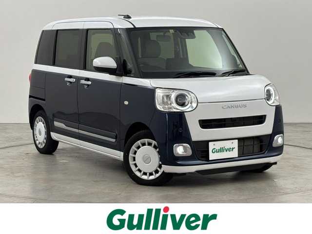 ダイハツ ムーヴ キャンバス ストライプス G 福岡県 2022(令4)年 1.1万km シャイニングホワイトパール/レーザーブルークリスタルシャイン 社外ディスプレイオーディオ　/バックカメラ　/両側パワースライドドア　/ワイヤレス充電　/ＥＴＣ　/ホッとカップホルダー　/衝突軽減　/レーンキープ　/コーナーセンサー　/アクセル踏み間違い防止　/横滑り防止　/シートヒーター　/ＬＥＤ