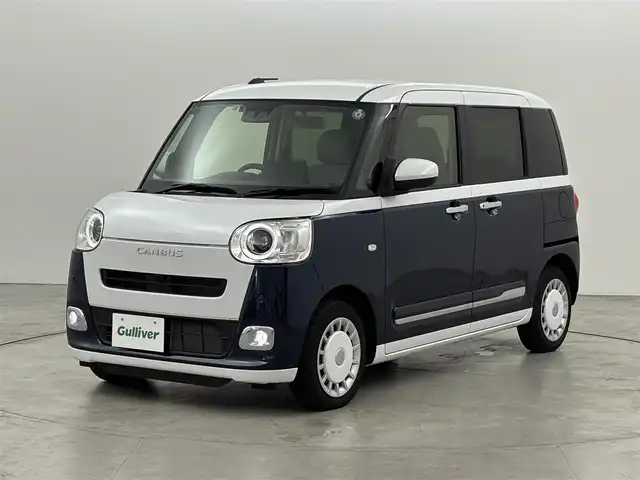 ダイハツ ムーヴ キャンバス ストライプス G 福岡県 2022(令4)年 1.1万km シャイニングホワイトパール/レーザーブルークリスタルシャイン 社外ディスプレイオーディオ　/バックカメラ　/両側パワースライドドア　/ワイヤレス充電　/ＥＴＣ　/ホッとカップホルダー　/衝突軽減　/レーンキープ　/コーナーセンサー　/アクセル踏み間違い防止　/横滑り防止　/シートヒーター　/ＬＥＤ