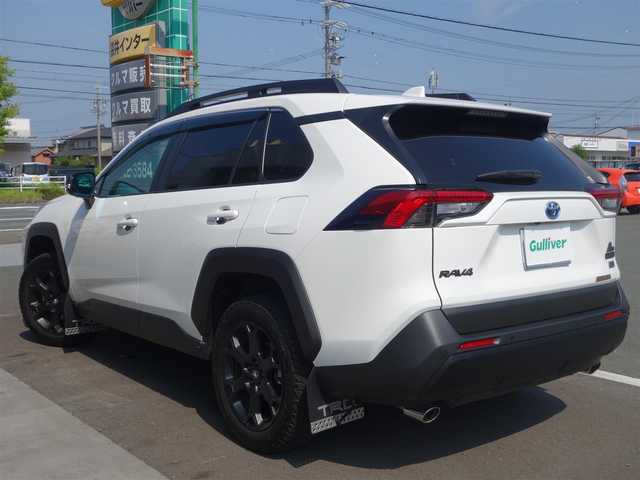 トヨタ ＲＡＶ４ HV アドベンチャー オフロードPKGⅡ 静岡県 2024(令6)年 0.3万km スーパーホワイトⅡ ワンオーナー／禁煙車/走行距離2951キロ/車検9年3月26日/トヨタセーフティセンス/　・プリクラッシュセーフティ/　・レーンとレーシングアシスト/　・オートマチックハイビーム/　・ロードサインアシスト/　・レーダークルーズコントロール/　・先行車発進のお知らせ/10.5インチディスプレイオーディオプラス/　ナビ/BT/USB/HDMI/AM.FM/フルセグTV/AppleCarPlay／Android audio/ETC2.0/パノラミックビューモニター/BSM/デジタルインナーミラー/ステアリングヒーター/前席シートヒーター／エアシート/運転席メモリー機能付パワーシート/パワーバックドア／ハンズフリー/ルーフレール/純正専用サスペンション/TRDマッドガード/ドアハンドルプロテクター/LEDヘッドライト／オートマチックハイビーム/社外3Dフロアマット／トランクマット/純正ドアバイザー/取扱説明書／保証書