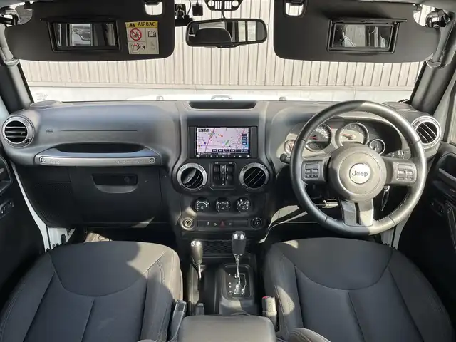 クライスラー・ジープ ジープ ラングラー 青森県 2016(平28)年 5.9万km ブライトホワイト 社外メモリナビ/(フルセグTV/CD/DVD/Bluetooth)/後席モニター/バックカメラ/ドライブレコーダー　前のみ/4WD/ETC/サイドモニター/純正アルミホイール/純正フロアマット/オートライト/保証書取説　あり