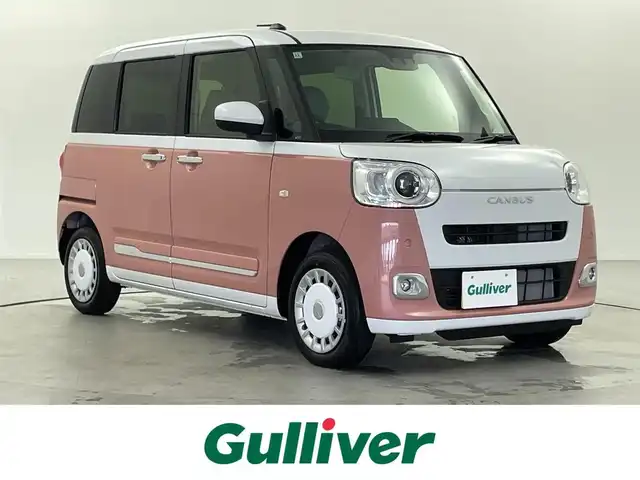 ダイハツ ムーヴ キャンバス ストライプス G 熊本県 2024(令6)年 0.1千km シャイニングホワイトパール/アプリコットピンクメタリック ナビ装着用アップグレードパック/両側パワースライドドア/USBソケット/保温カップホルダー/前席シートヒーター/プッシュスタート/電動格納ミラー/純正ホイールキャップ/前後コーナーセンサー/LEDライト/フォグランプ/オートライト/オートホールド/ステアリングスイッチ/スペアキー