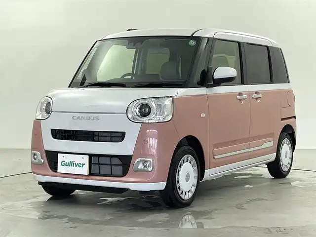 ダイハツ ムーヴ キャンバス ストライプス G 熊本県 2024(令6)年 0.1千km シャイニングホワイトパール/アプリコットピンクメタリック ナビ装着用アップグレードパック/両側パワースライドドア/USBソケット/保温カップホルダー/前席シートヒーター/プッシュスタート/電動格納ミラー/純正ホイールキャップ/前後コーナーセンサー/LEDライト/フォグランプ/オートライト/オートホールド/ステアリングスイッチ/スペアキー