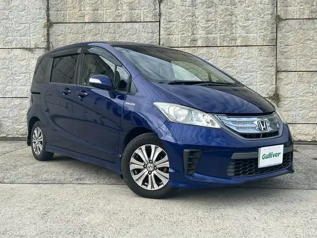 ホンダ フリード ハイブリット ジャストセレクション 長崎県 2012(平24)年 10.1万km コバルトブルーパール ワンオーナー/純正メモリナビ/（CD/DVD/BT/フルセグ）/バックカメラ/フリップダウンモニター/クルーズコントロール/両側パワースライドドア/ハーフレザーシート/オートライト/ETC/電動格納ミラー/純正15インチAW