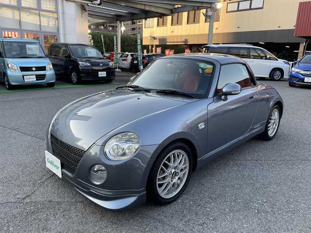 ダイハツ コペン ULTIMATE Ⅱ メモリアル 神奈川県 2007(平19)年 9万km グレーメタリック 100周年記念特別仕様車/ アルティメットエディションIIメモリアル/ アルカンターラRECAROシート/ MOMO製ステアリング/ MOMO製シフトノブ/ ビルシュタインサスペンション/ BBS製15インチアルミ/社外メモリーナビ（MDV-M807HD)/ CD/DVD/BT/SD/フルセグTV/バックカメラ/電動オープンメタルトップ/D SPORT ボディダンパー/ フロント、フロントアンダー、リア/D席、N席シートヒーター/HIDヘッドライト/ETC車載器/純正フロアマット/保証書あり/取扱説明書あり/スペアキーあり