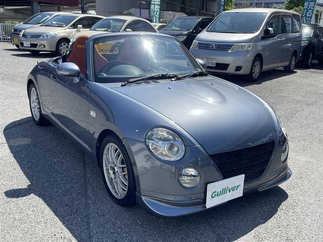 ダイハツ コペン ULTIMATE Ⅱ メモリアル 神奈川県 2007(平19)年 9万km グレーメタリック 100周年記念特別仕様車/ アルティメットエディションIIメモリアル/ アルカンターラRECAROシート/ MOMO製ステアリング/ MOMO製シフトノブ/ ビルシュタインサスペンション/ BBS製15インチアルミ/社外メモリーナビ（MDV-M807HD)/ CD/DVD/BT/SD/フルセグTV/バックカメラ/電動オープンメタルトップ/D SPORT ボディダンパー/ フロント、フロントアンダー、リア/D席、N席シートヒーター/HIDヘッドライト/ETC車載器/純正フロアマット/保証書あり/取扱説明書あり/スペアキーあり