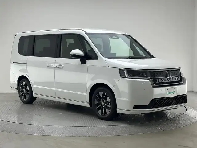 ホンダ ステップワゴン スパーダ eHEV 兵庫県 2025(令7)年 0.1千km プラチナホワイトパール スパーダ　e:HEV　4CJ4AP3　/11.4インチナビHondaCONNECTナビ/・LXM-247VFLi(317900円)/登録済未使用車/純正メモリナビ(CD/DVD/SD/Bt/フルセグ)/バックカメラ/両側パワースライドドア/パワーバックドア/コーナーセンサー/パドルシフト/ハーフレザー/シートヒーター/ACC/LKA/PCS/BSM/ヘッドライトレベライザー/オートハイビーム/LEDヘッドライト/LEDフォグランプ/純正16インチAW